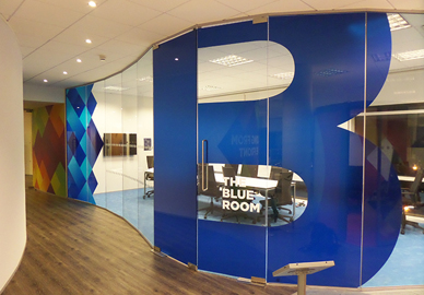 large glass partition wall with manifestation