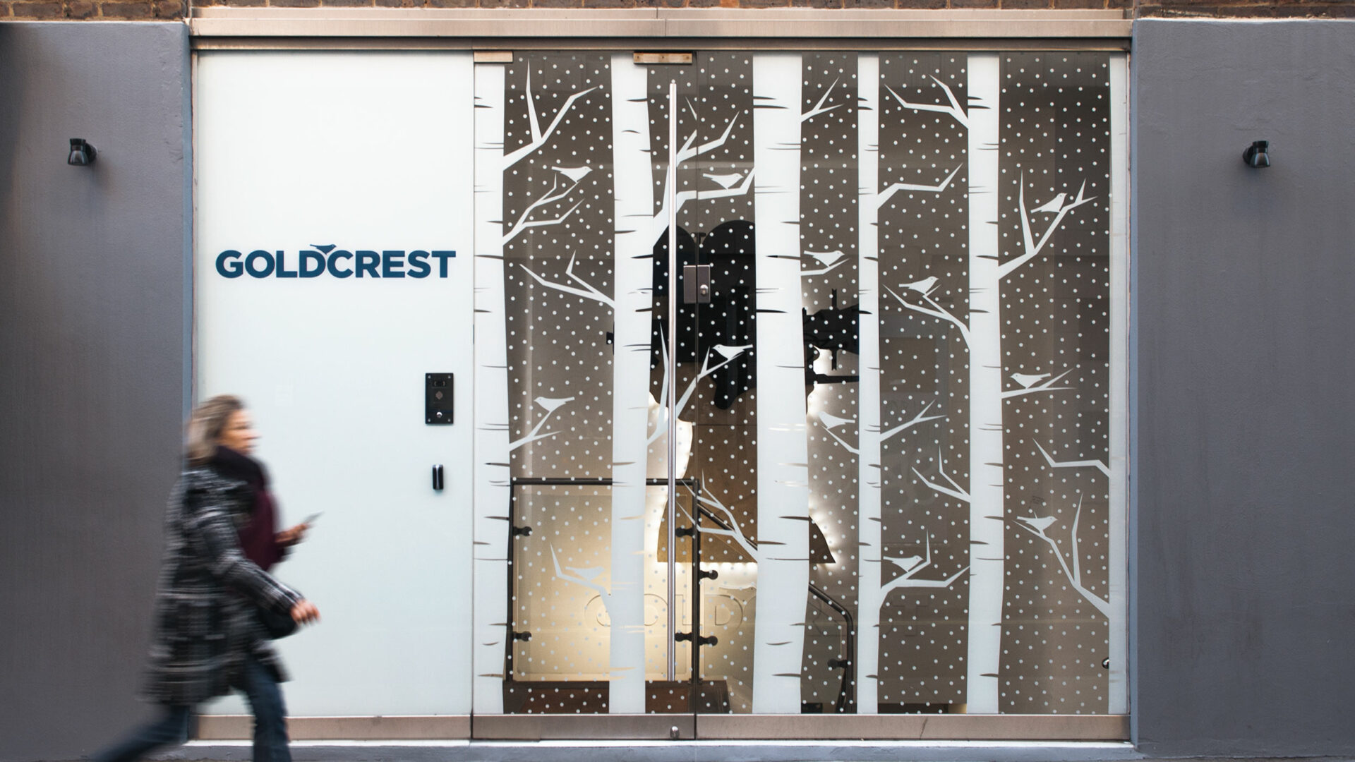 Street view Goldcrest film with passers by Christmas festive window graphics print and installation