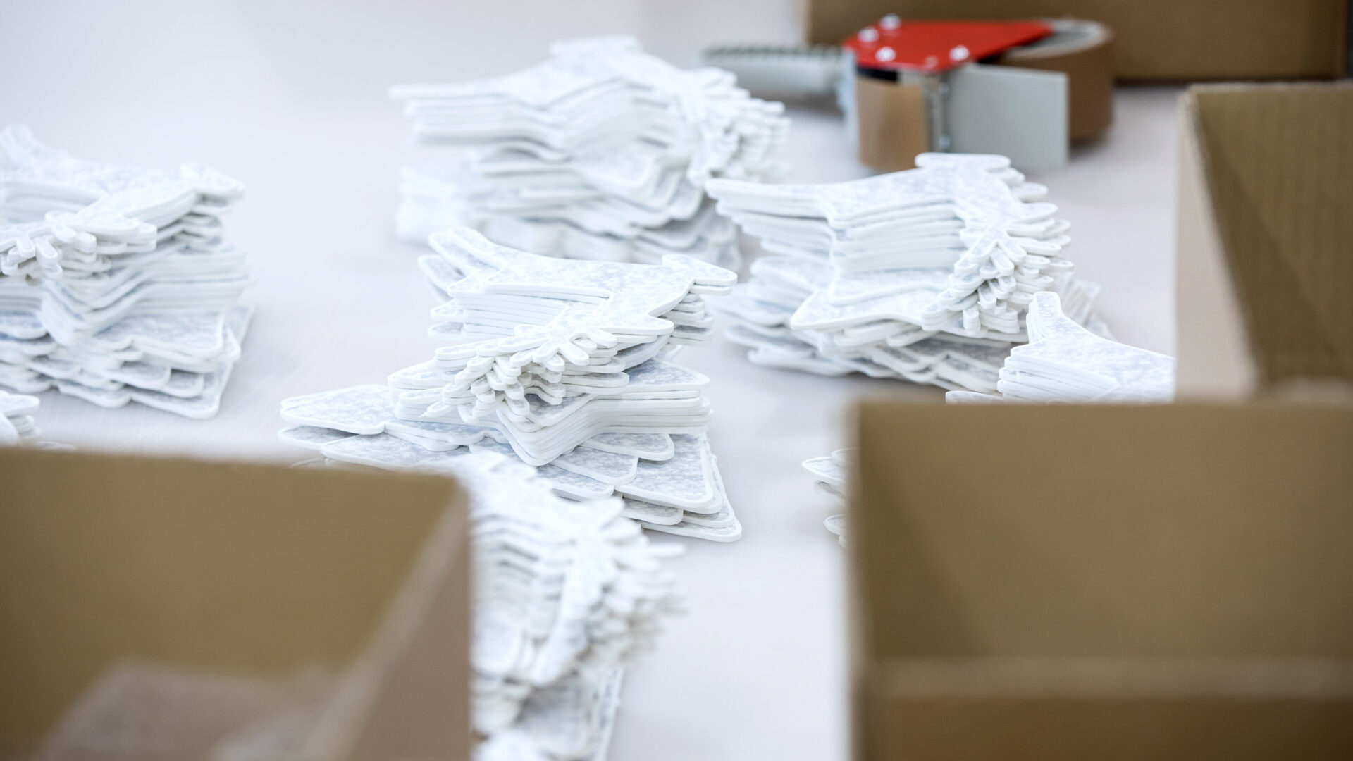 White Christmas decorations piled up for distribution to EAT Foodchain