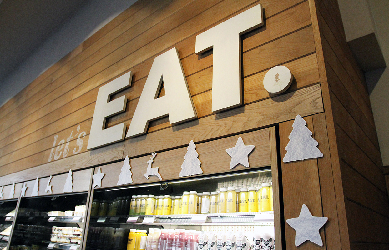 EAT Foodchain Christmas point of sale graphic decoration displayed on the store fridges