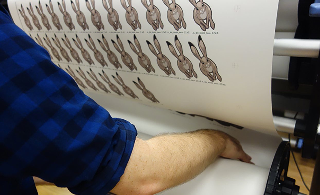 Man working the printer for the 3mm Foamex animal shapes in production for John Lewis