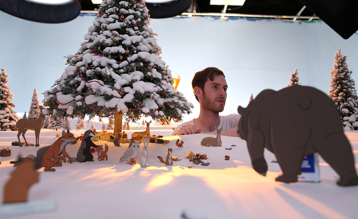 Production scene of the John Lewis advert, man placing finished graphics by The Graphical Tree