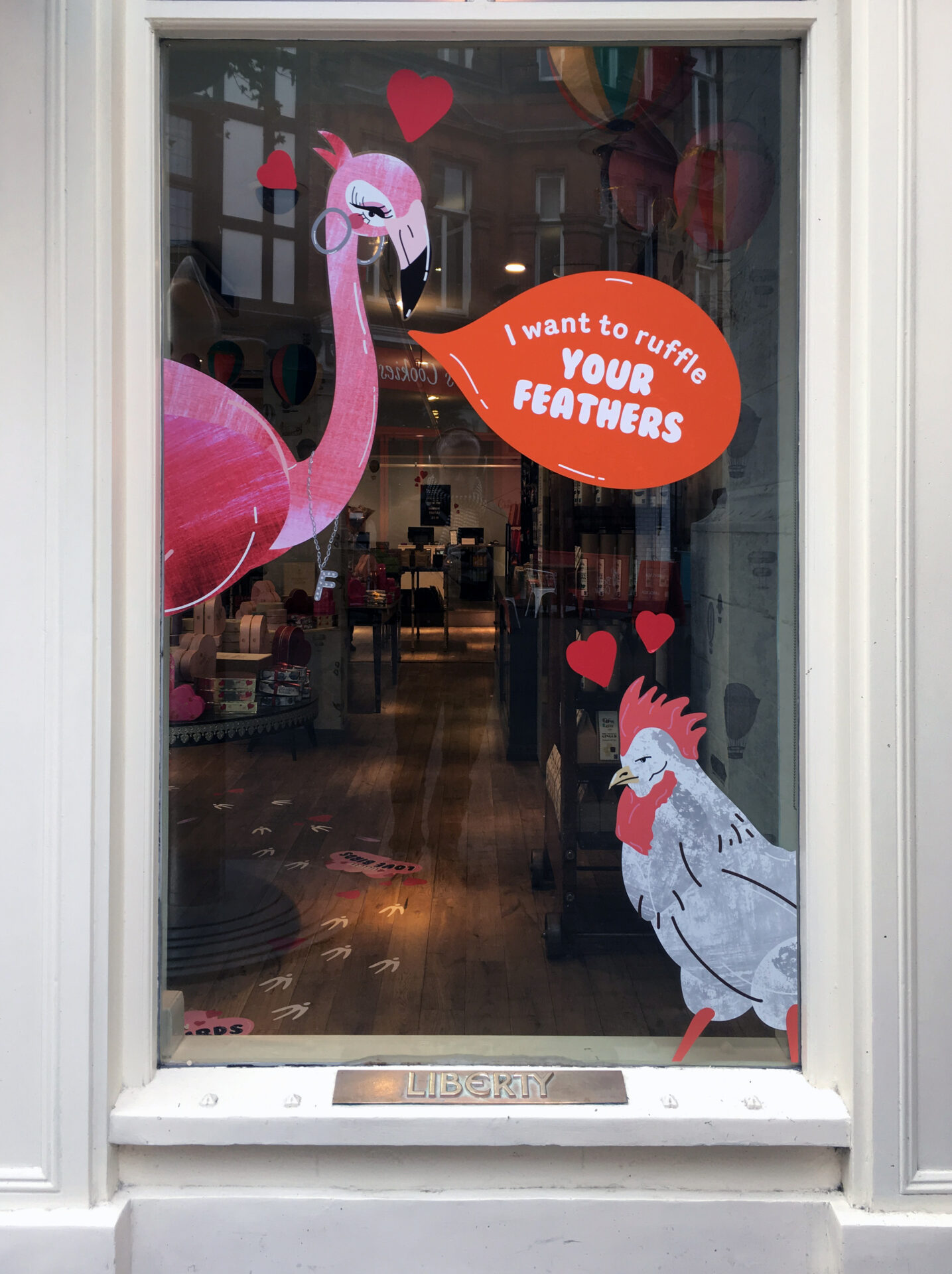 Colourful window decals at Liberty, the Love Birds Valentine campaign