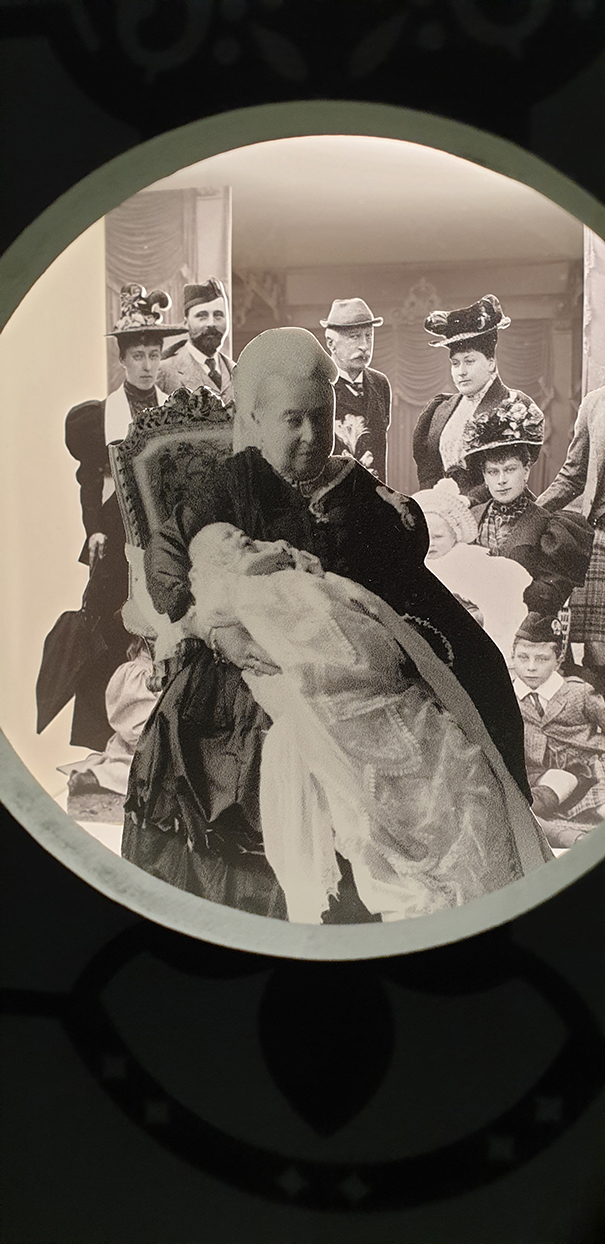 baby queen victoria being held, as a black and white photo collage