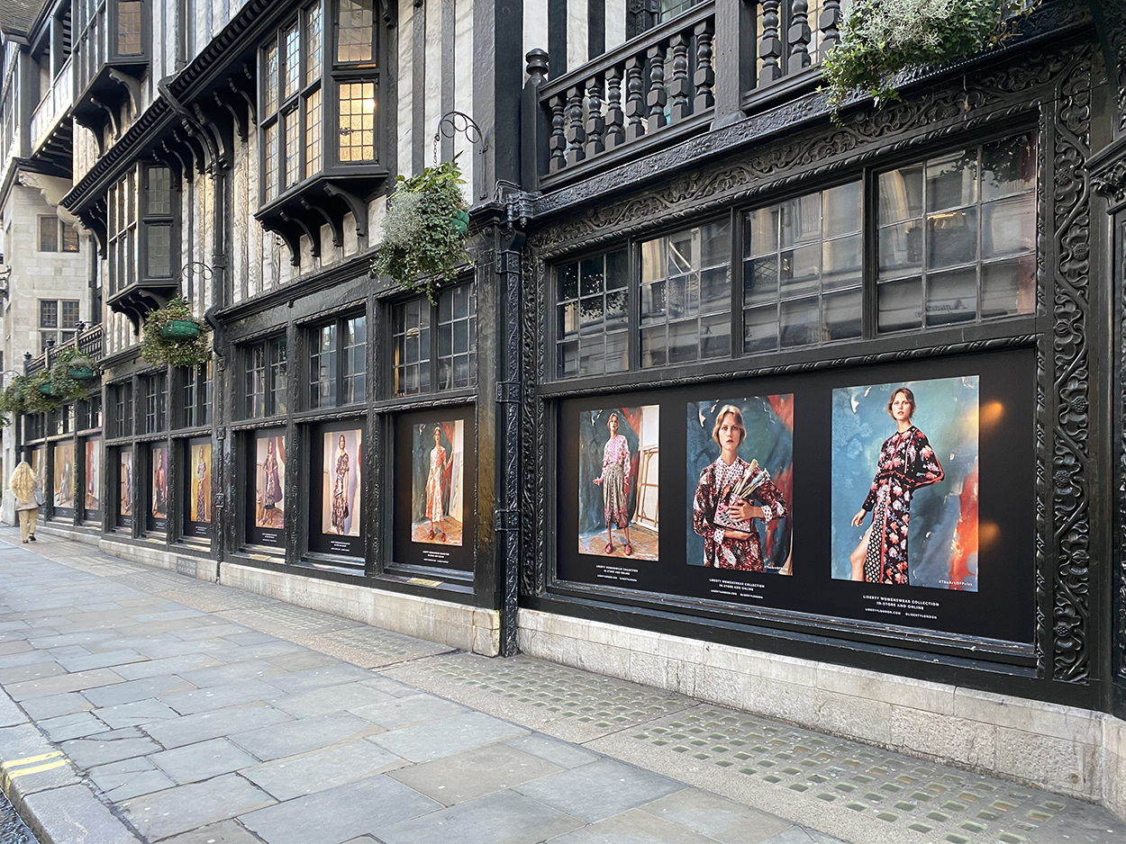Full street view of the portrait prints in Liberty's windows for the women's collection