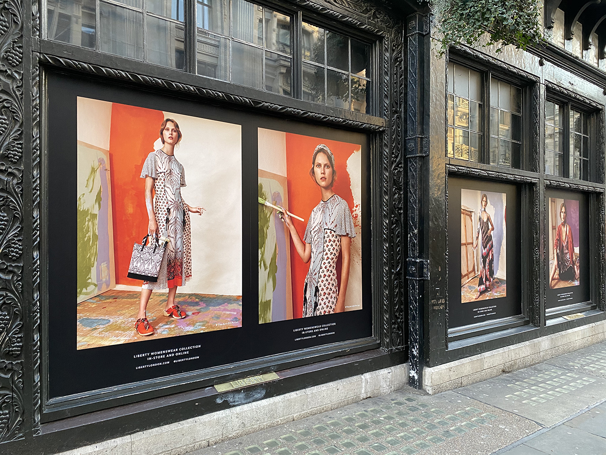 Portrait style art prints displayed in Liberty's windows for the women's collection