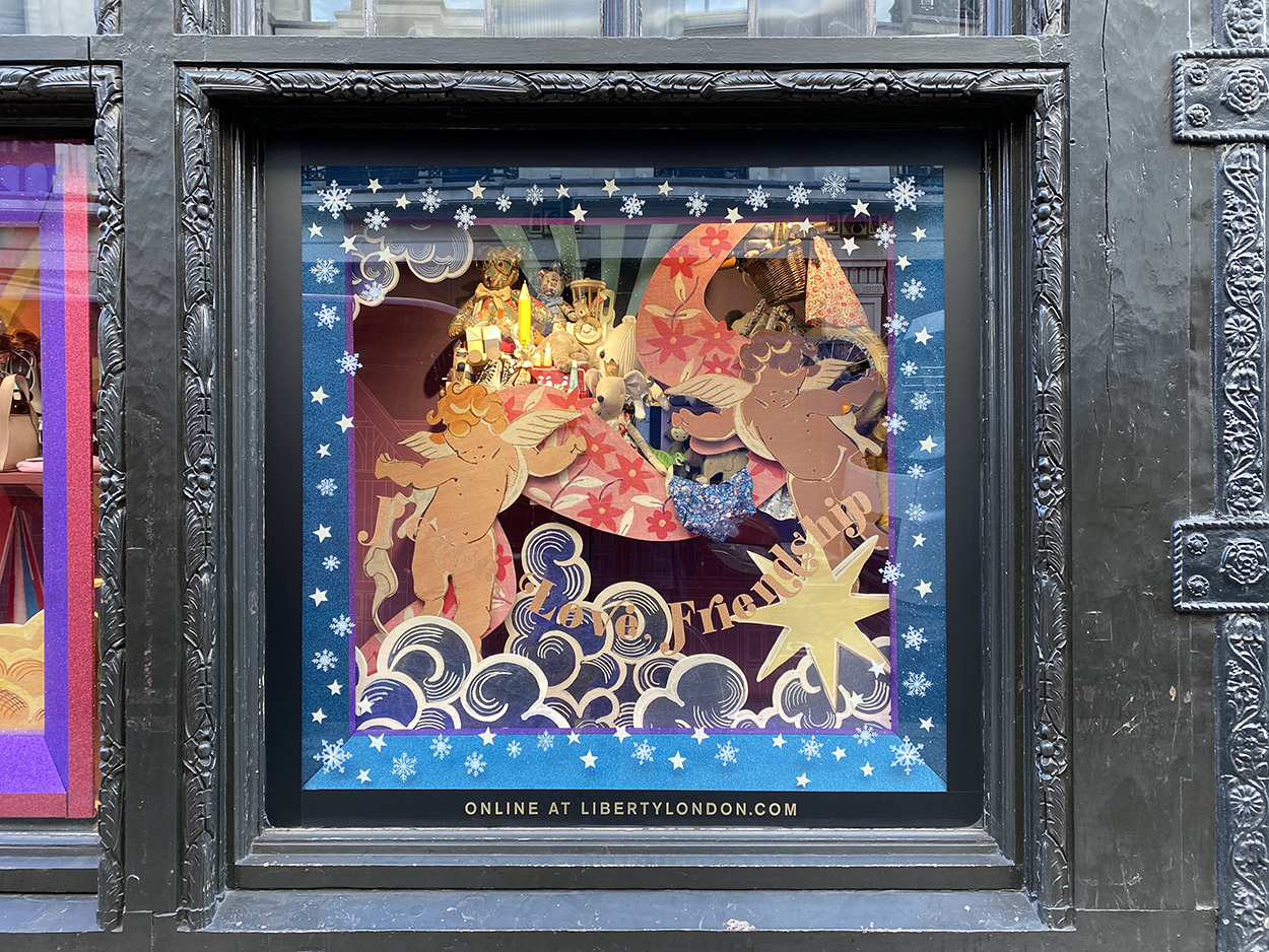 Colourful, creative, cut out decals, shapes & Christmas window display for Liberty