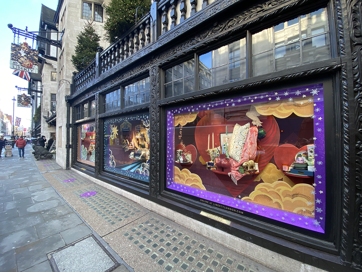The colourful, creative shop window set design in full view for passers by at Liberty