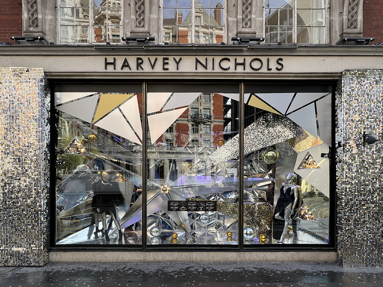 disco ball window panels with sequins that frame the Harvey Nichols windows & mirrored decorations